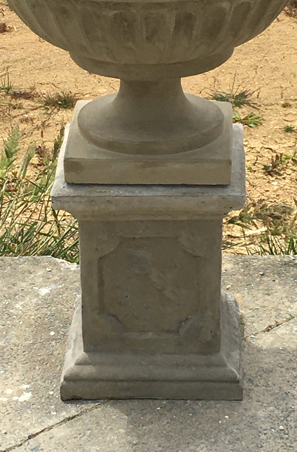 The Faraway Garden Alsace Pedestal is a simple, classically proportioned pedestal with distinctive cross detailing on the sides. A pair of stunning pedestals flanking both sides of your garden entrance makes a refined and elegant statement. Partner it with one of our statues or an urn to complete the look.