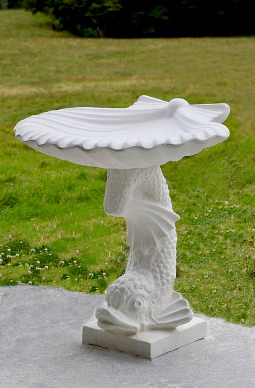 The Faraway Garden Salacia Bird Bath is a stunning pedestal bird bath with dramatic scallop shell bowl and fish shaped base. A beautiful showpiece for any garden setting; whether placed at the end of a formal green hedged pathway, on a terrace or in a rambling herbaceous border.
