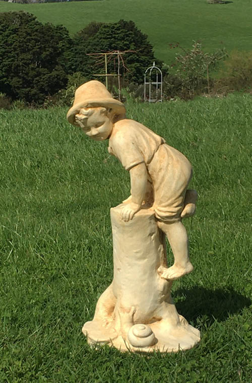 The Faraway Garden Boy with Snail is a small statue depicting a boy climbing a log to escape from a snail. He is a favourite character to add to any garden setting and looks great in our sepia wash for an aged effect.