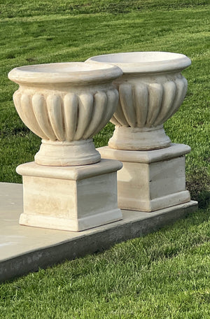 The Faraway Garden Calabria Urn is an elegant garden planter inspired by the classical aesthetic of Ancient Rome and popular in the Renaissance with its regular, ornamental curved moulding or gadrooning, reminiscent of flower petals.

This impressive garden planter would look gorgeous as part of a group or positioned on a Faraway Garden pedestal and the focal point at the end of pathway or the centrepiece of a rose garden. It can be sepia washed for an aged effect. Shown here in sepia.