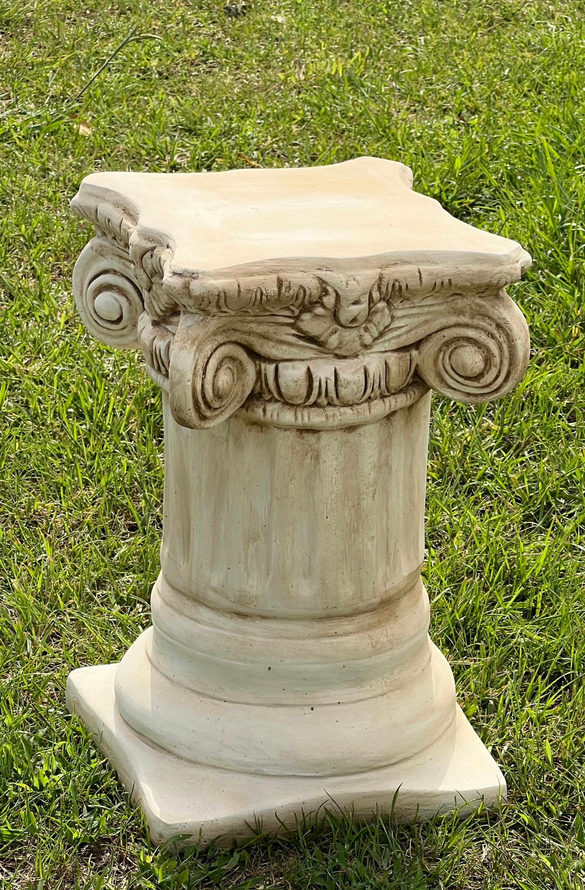The Faraway Garden Grecian Column is an elegantly shaped plinth with doric indentation and distinctive detailing on capital. A pair of these pedestals flanking both sides of your garden entrance makes a refined and elegant statement. Partnered with one of our statues or a planter to complete the look. Shown here with our Lovers Statue, sold separately.