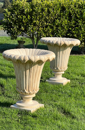 The Faraway Garden Tulip Planter is a timelessly elegant large garden planter inspired by the graceful shape of a tulip flower. Tulip-shaped planters also known as tulipieres or tulip vases, originated in the Netherlands in the 17th century, reflecting the era's fascination with the plant and high value of tulips.