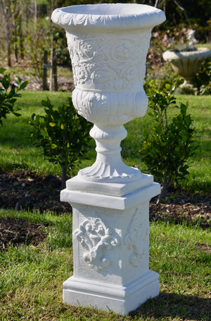 The Faraway Garden Byzantine Vase is a timelessly elegant garden planter inspired by the classical ancient Greek aesthetic. It features elaborate moulding on the bowl and pedestal and egg and dart moulding around rim.  These garden planters are ideal as a pair placed on one of our Faraway Garden pedestals where they become the perfect statement focal point to a terrace, walkway or entrance.