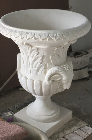 The Faraway Garden Ovid Urn is a large, elegant garden planter inspired by the classical Greek aesthetic with elaborate leaf moulding on the rim and around bowl. The detailed goat motif symbolises abundance, determination, health and vitality. This urn looks wonderful in a sepia wash for an instant aged effect.  This unique garden planter would look stunning as part of a group or positioned on a Faraway Garden pedestal and the focal point at the end of pathway or the centrepiece of a rose garden.